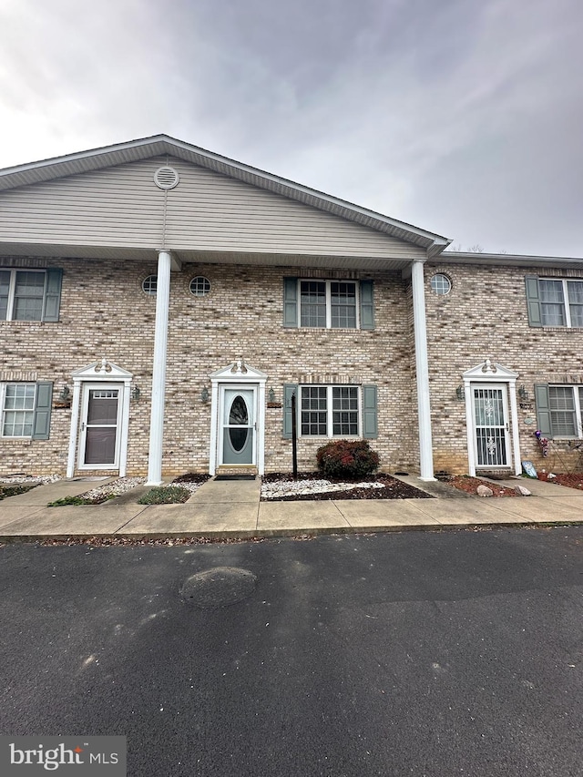 view of front of house featuring brick siding