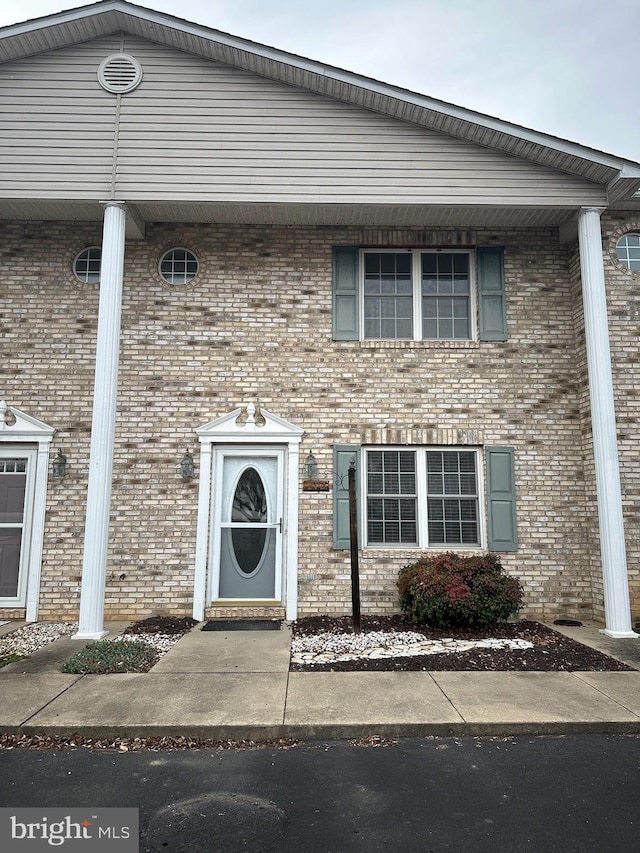 view of front of property with brick siding