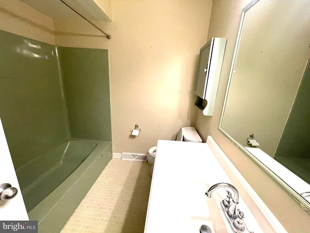 full bath with tile patterned floors, visible vents, toilet, washtub / shower combination, and baseboards