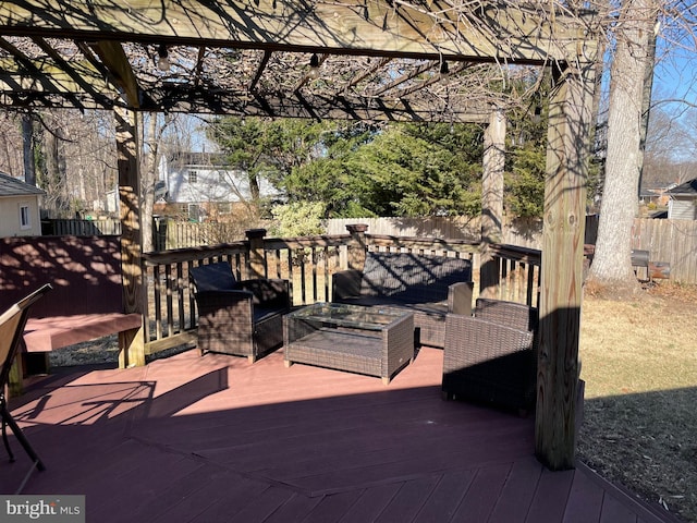 wooden deck with an outdoor hangout area, a fenced backyard, and a pergola