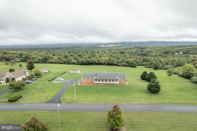 bird's eye view with a rural view and a wooded view