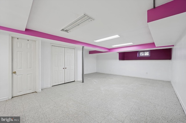 bonus room featuring baseboards and tile patterned floors