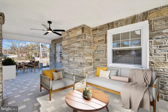 view of patio / terrace featuring ceiling fan, outdoor dining area, and an outdoor hangout area