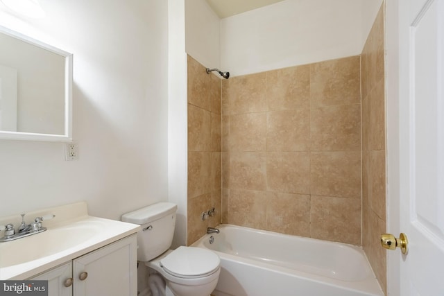 bathroom featuring  shower combination, vanity, and toilet