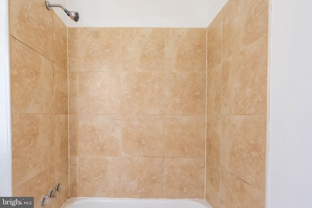 bathroom with shower / washtub combination