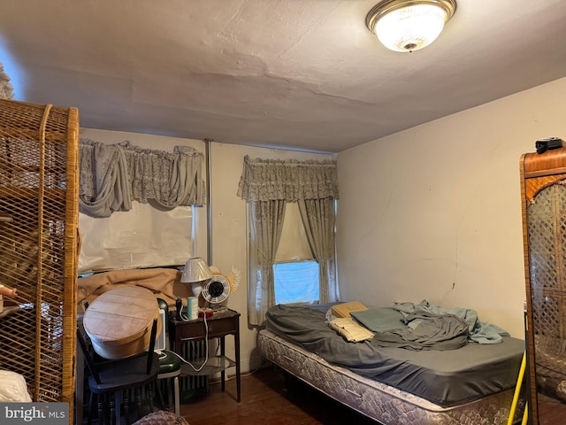 bedroom with wood finished floors