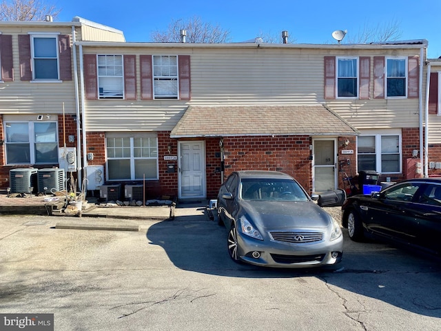 multi unit property with brick siding and central AC unit