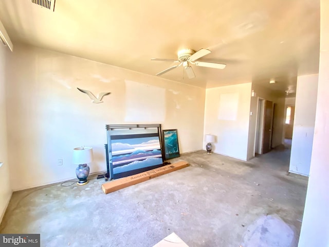 unfurnished living room with visible vents, unfinished concrete flooring, and a ceiling fan