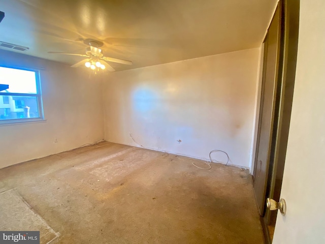 spare room with visible vents and ceiling fan