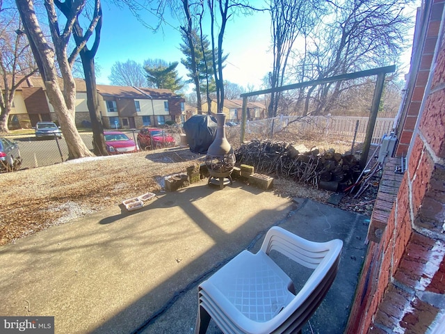 view of patio / terrace featuring a residential view and a fenced backyard