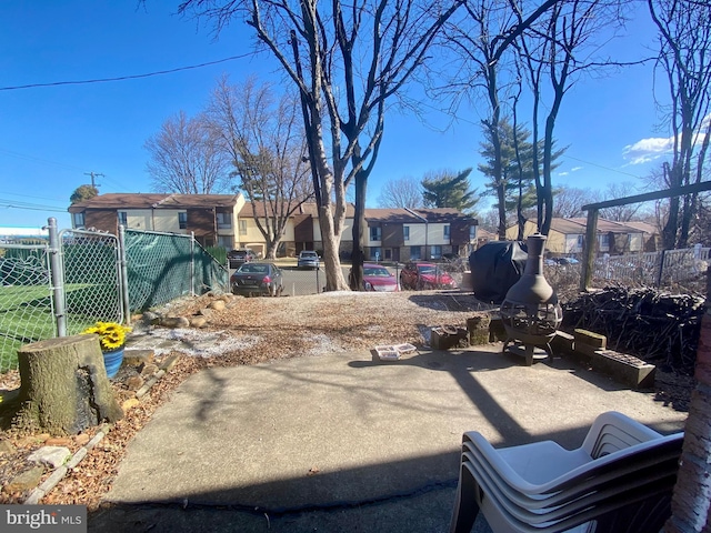 view of yard with a gate, a residential view, and fence