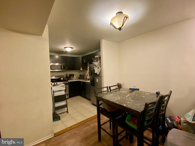 dining area featuring light wood-style flooring