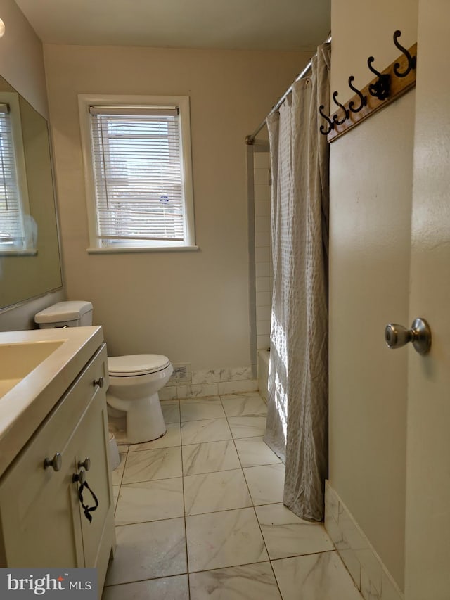 1205 Stratwood Ave, Oxon Hill, MD 20745 - full bath featuring visible vents, baseboards, toilet, marble finish floor, and vanity