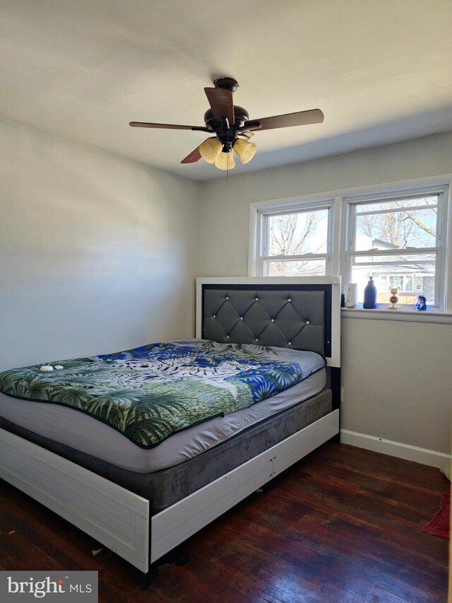 1205 Stratwood Ave, Oxon Hill, MD 20745 - bedroom with multiple windows, wood finished floors, baseboards, and ceiling fan