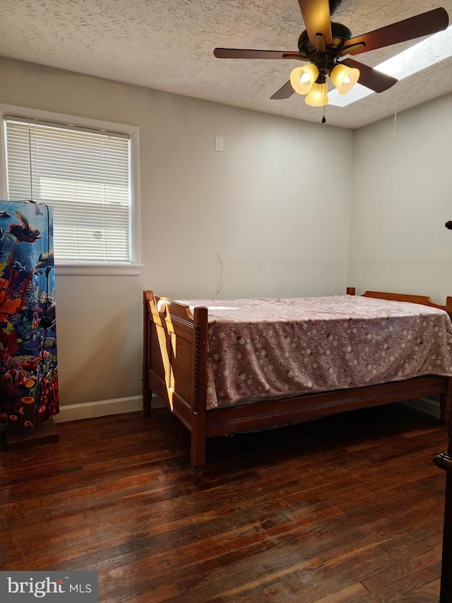 1205 Stratwood Ave, Oxon Hill, MD 20745 - bedroom featuring a ceiling fan, baseboards, wood-type flooring, and a textured ceiling