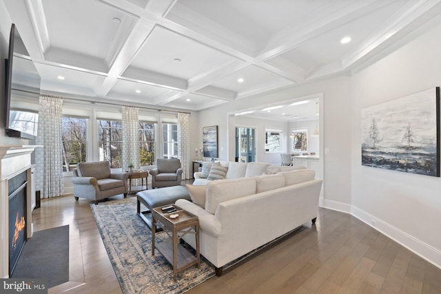 living room with dark wood-style floors, beam ceiling, a fireplace, coffered ceiling, and baseboards