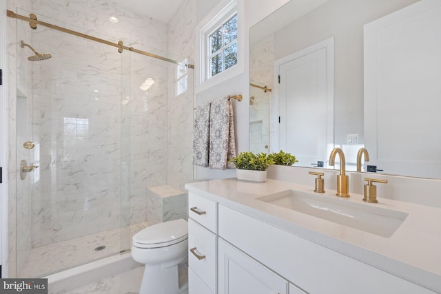 full bathroom with toilet, marble finish floor, a marble finish shower, and vanity