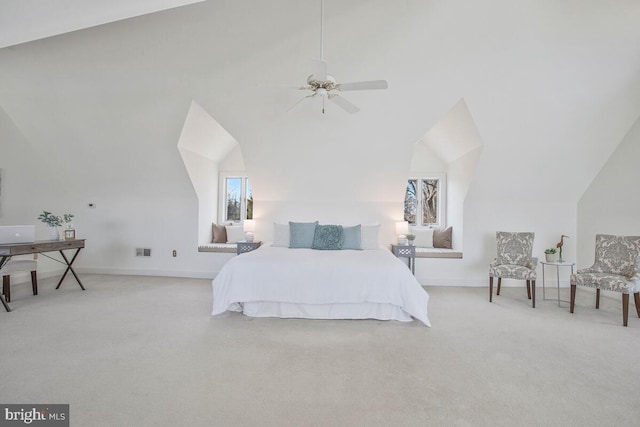 carpeted bedroom with lofted ceiling, multiple windows, visible vents, and baseboards