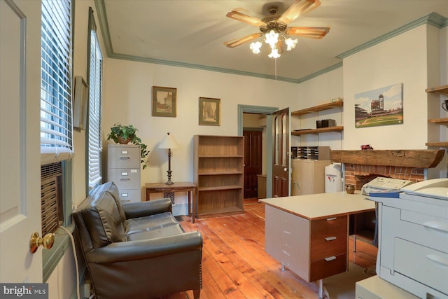 office featuring ornamental molding, light wood-style floors, and ceiling fan