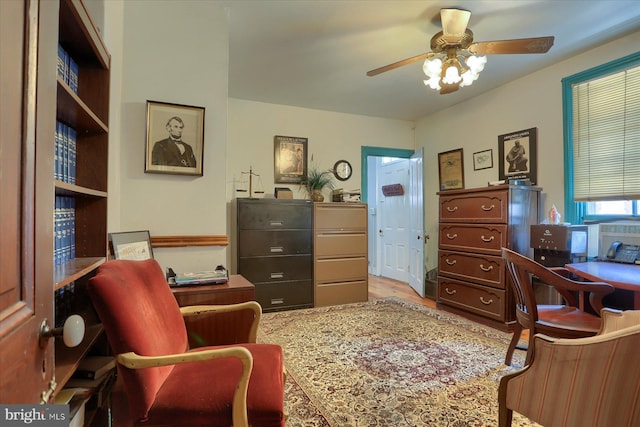 office area with ceiling fan and wood finished floors