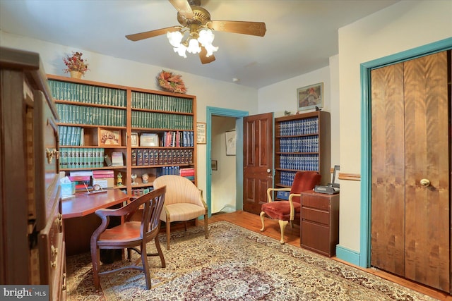 office featuring a ceiling fan and wood finished floors