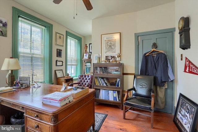 office space with a ceiling fan, a wealth of natural light, and wood finished floors