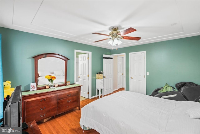 bedroom with ceiling fan and light wood-style floors