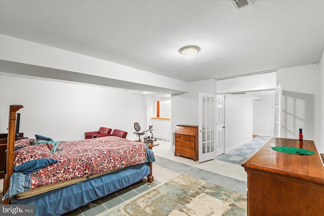 bedroom featuring visible vents and baseboards