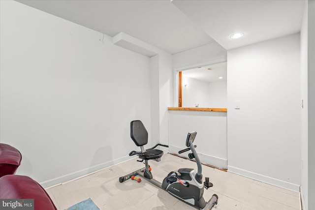 workout room with recessed lighting and baseboards