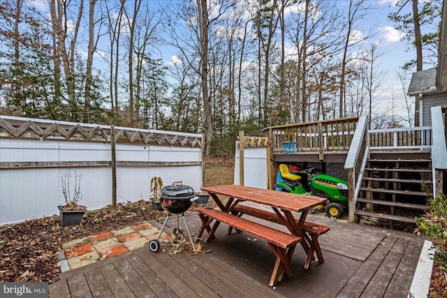 wooden terrace featuring stairway and outdoor dining area