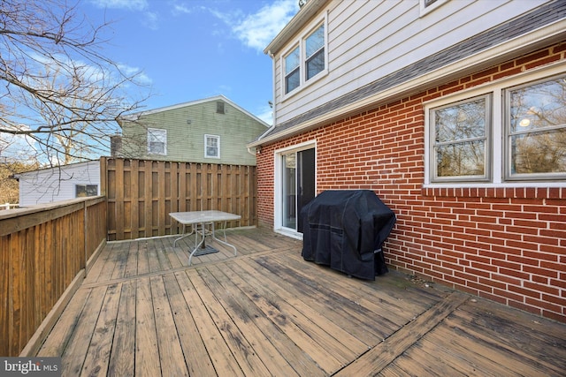 wooden terrace with area for grilling