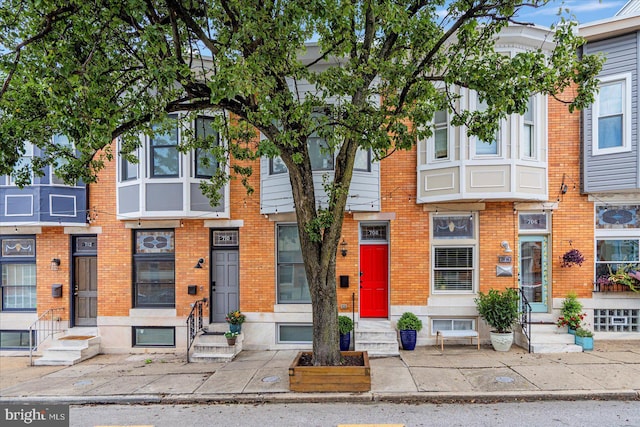 multi unit property with entry steps and brick siding