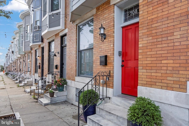 property entrance with brick siding