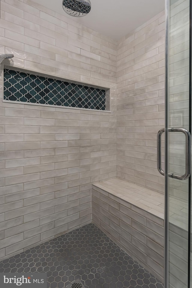 bathroom with a stall shower and a sauna