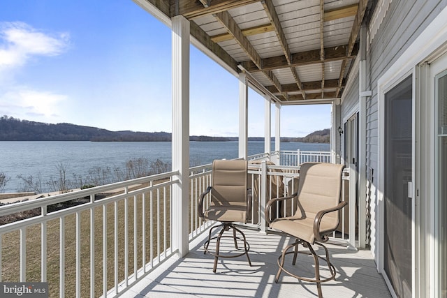 balcony featuring a water view