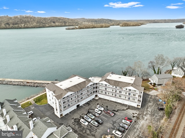 birds eye view of property with a water view