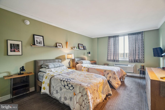 bedroom featuring ornamental molding, dark carpet, baseboards, and a wall mounted AC