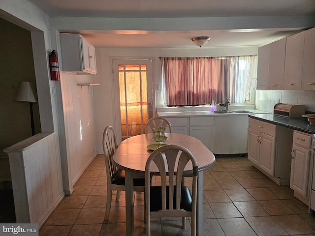 dining area with light tile patterned floors