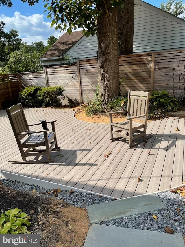 wooden deck featuring fence