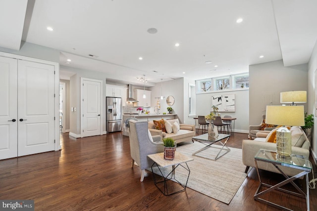 living room featuring recessed lighting and dark wood-type flooring