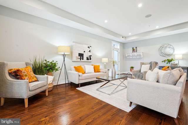 living room featuring recessed lighting, baseboards, and wood finished floors