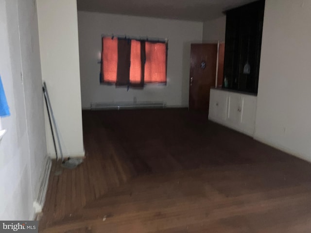 unfurnished living room featuring wood finished floors