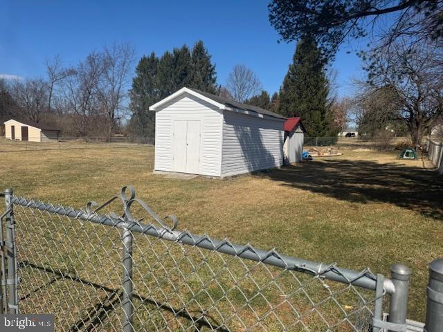 view of shed with fence