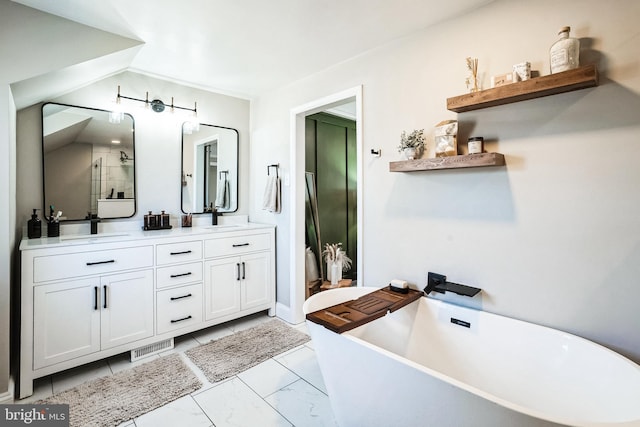 full bathroom featuring a shower stall, double vanity, a soaking tub, marble finish floor, and a sink