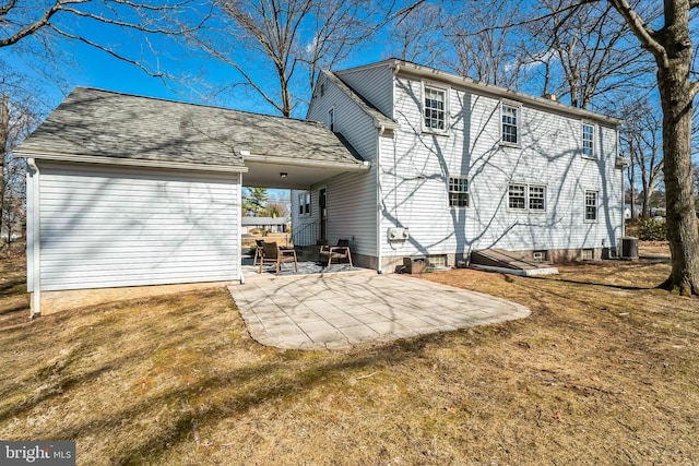 rear view of house featuring a lawn and a patio area