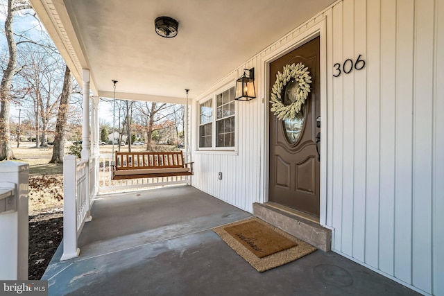 doorway to property featuring covered porch