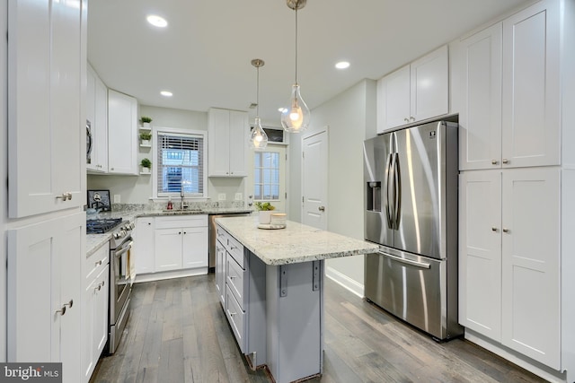 kitchen featuring dark wood finished floors, open shelves, white cabinetry, and stainless steel appliances