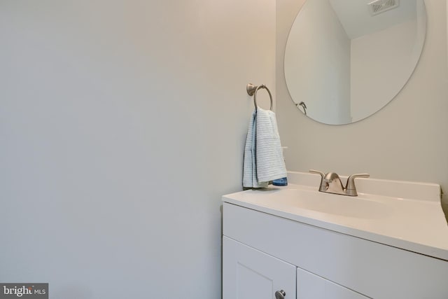 bathroom with vanity and visible vents