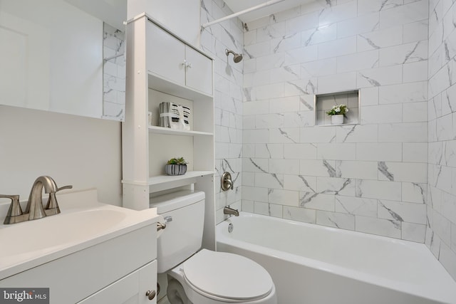 bathroom with tub / shower combination, toilet, and vanity