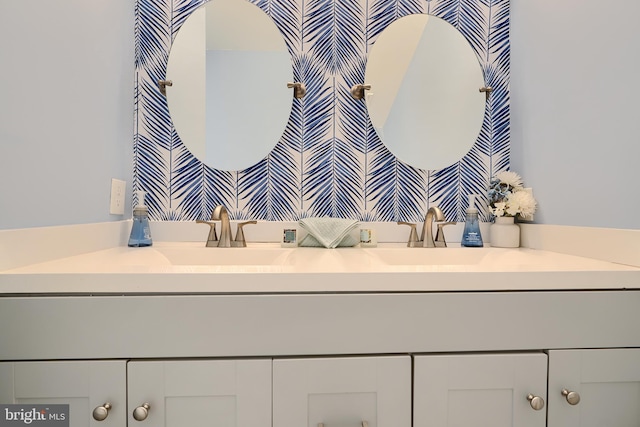 bathroom with double vanity and a sink